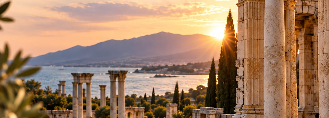 Ancient colonnade above the Aegean at sunset